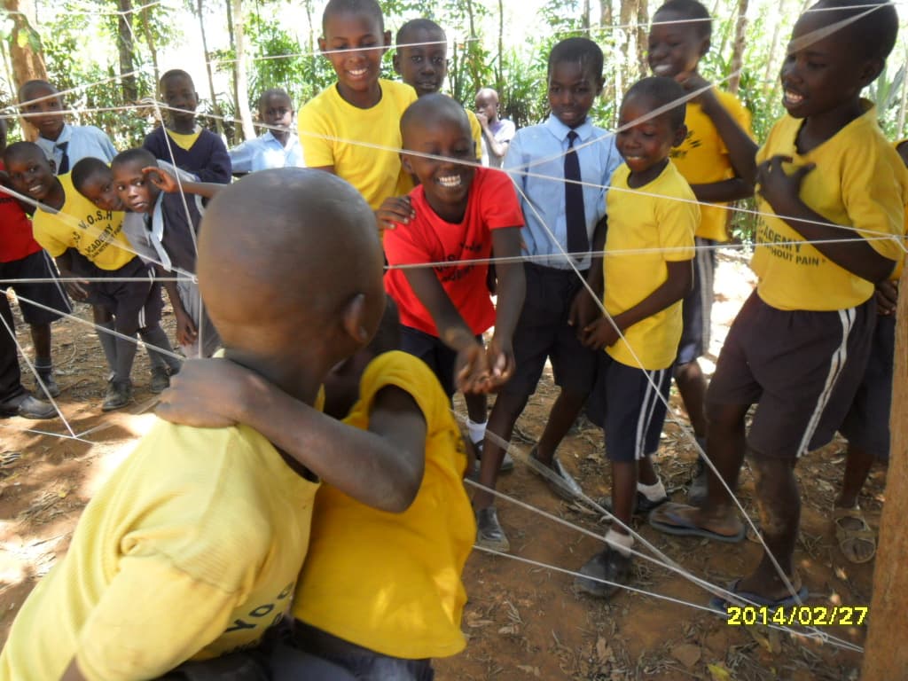 Yogo Academy students playing a string game